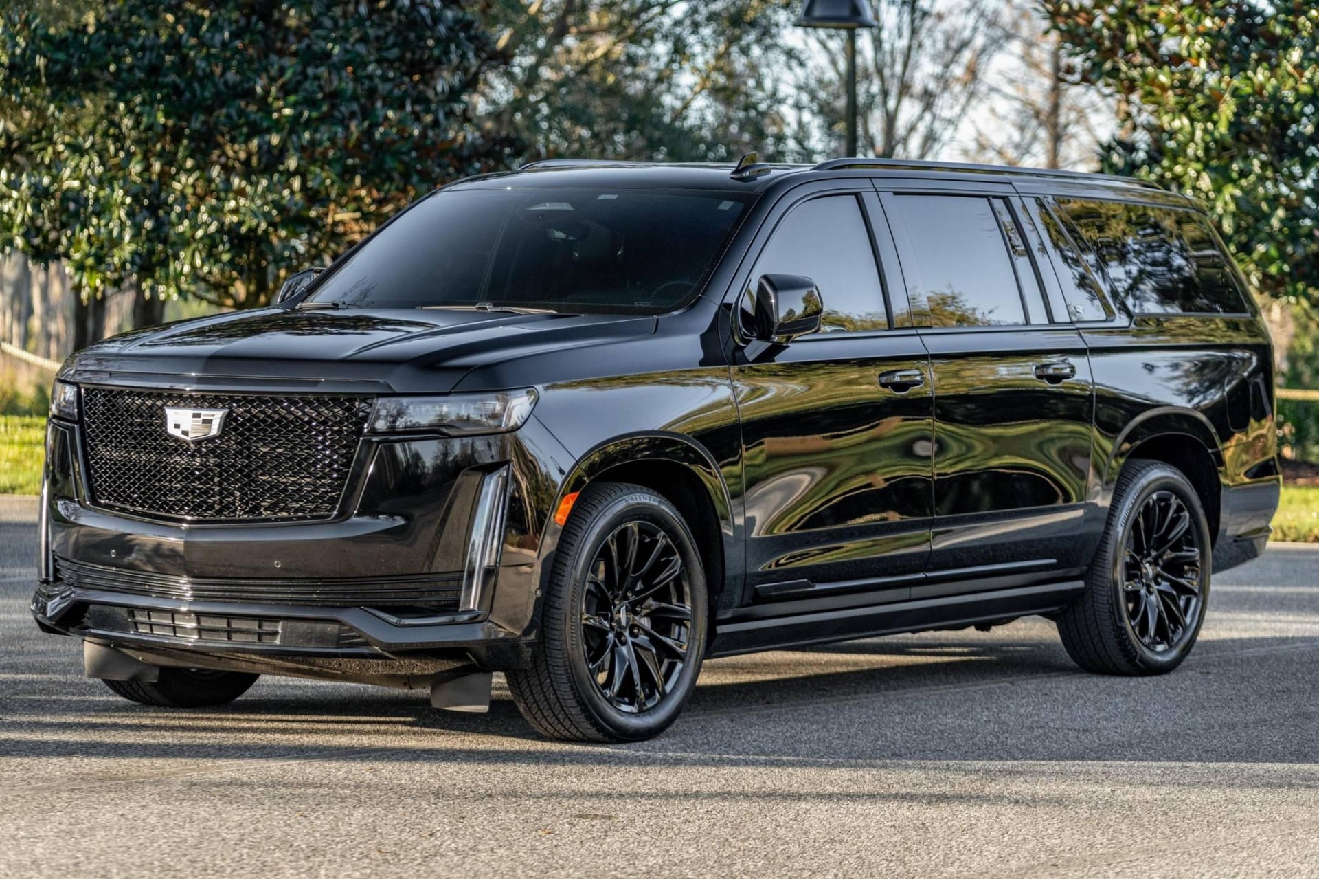 Black Cadillac Escalade ESV three-quarter front view